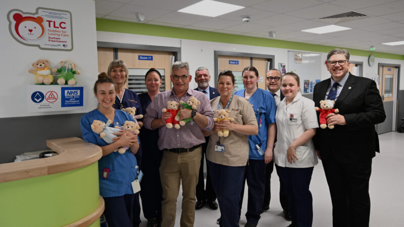 TLC teddy bears being held by emergency care staff