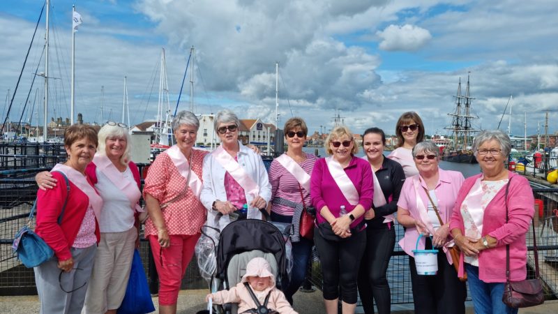 The walking group wearing pink.