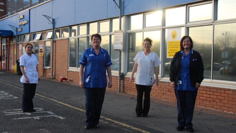Health workers standing outside the University Hospital of Hartlepool.