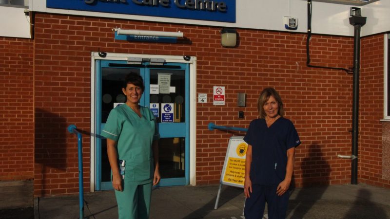 Hospital staff stand outside the urgent care centre at the University Hospital of Hartlepool.