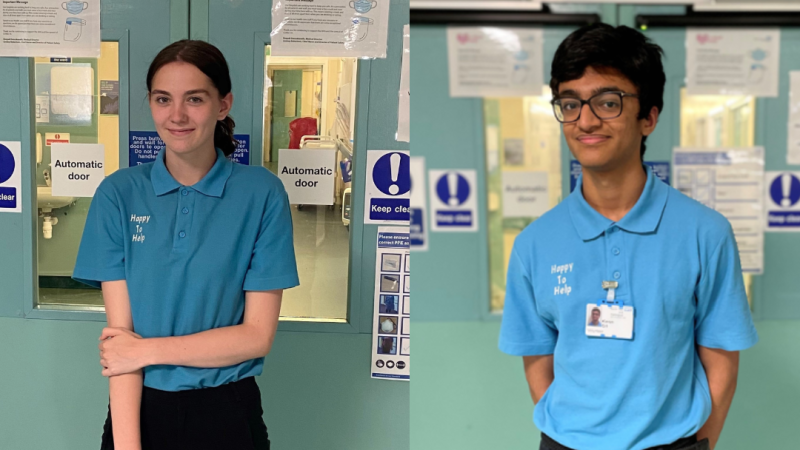 Young clinical volunteers stand in a corridor.