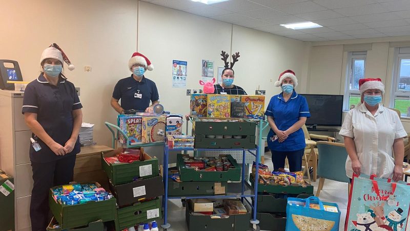 Staff with boxes of food donations.