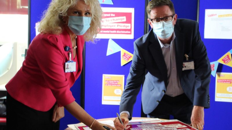 Julie Gillon and Alan Sheppard sign the pledge.