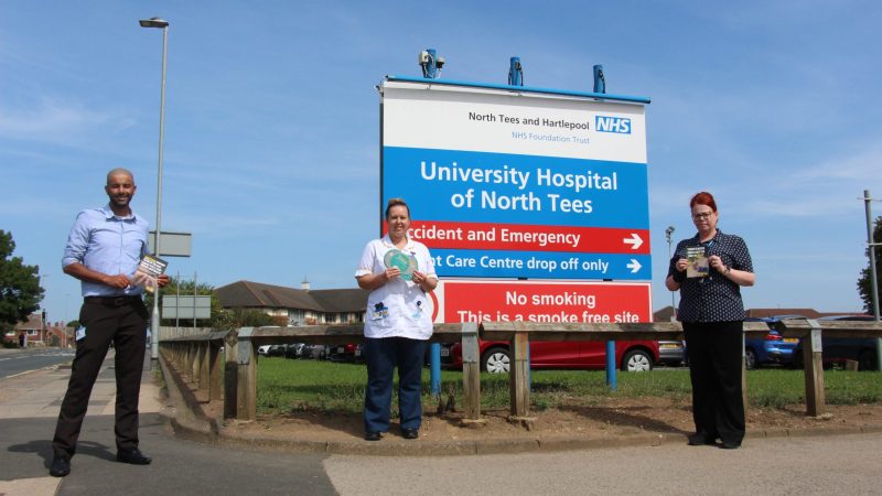 Staff outside the University Hospital of North Tees. They hold information about smoking.